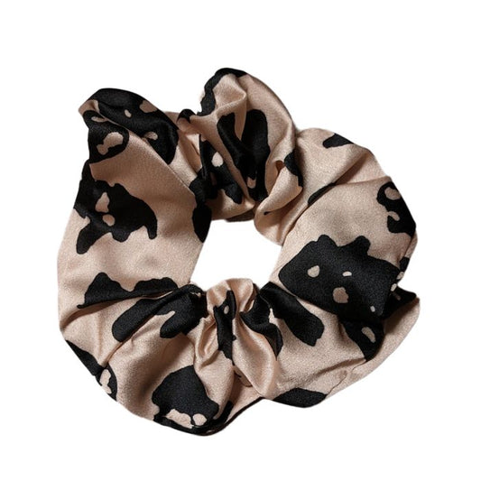 Cremfarbener Scrunchie mit schwarzem Akzent