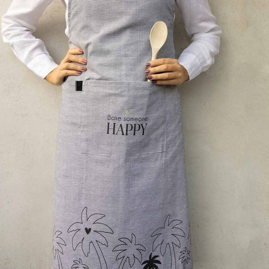 Bastion Collections Schürze Bake someone happy beim Backen getragen