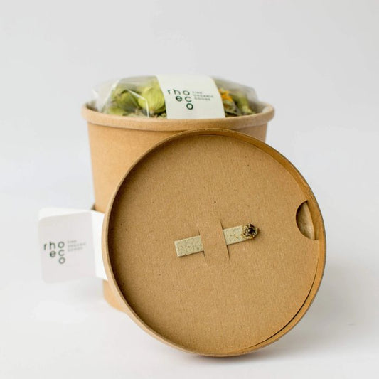 Nachhaltige Verpackung von rhoeco mit pflanzbarem Behälter
